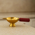 Golden Finish Brass Diya With Wooden Handle